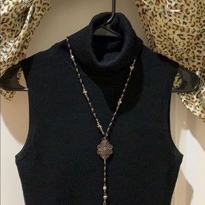 Allison Brittney black open shoulder turtle neck